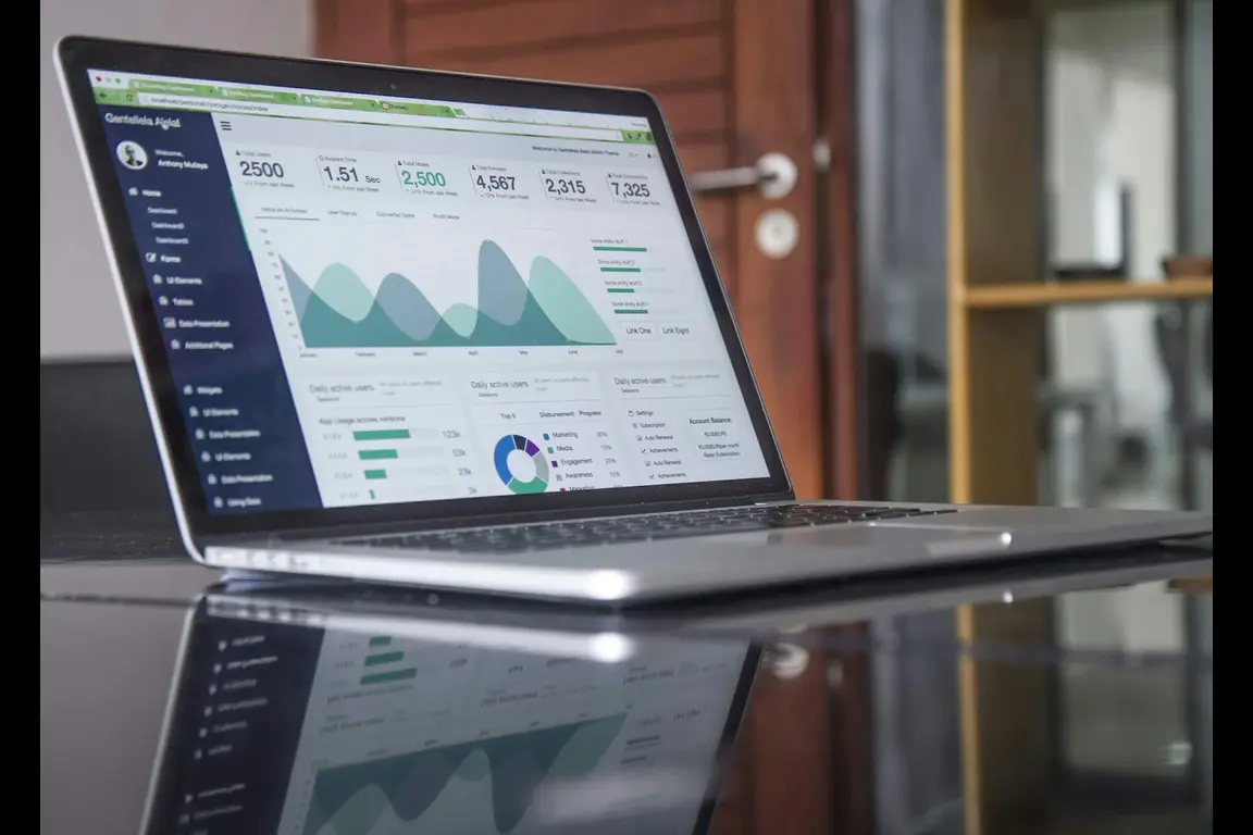 Dynamic image of a laptop on a table, showcasing vibrant growth statistics on the screen—a visual representation of success and progress.